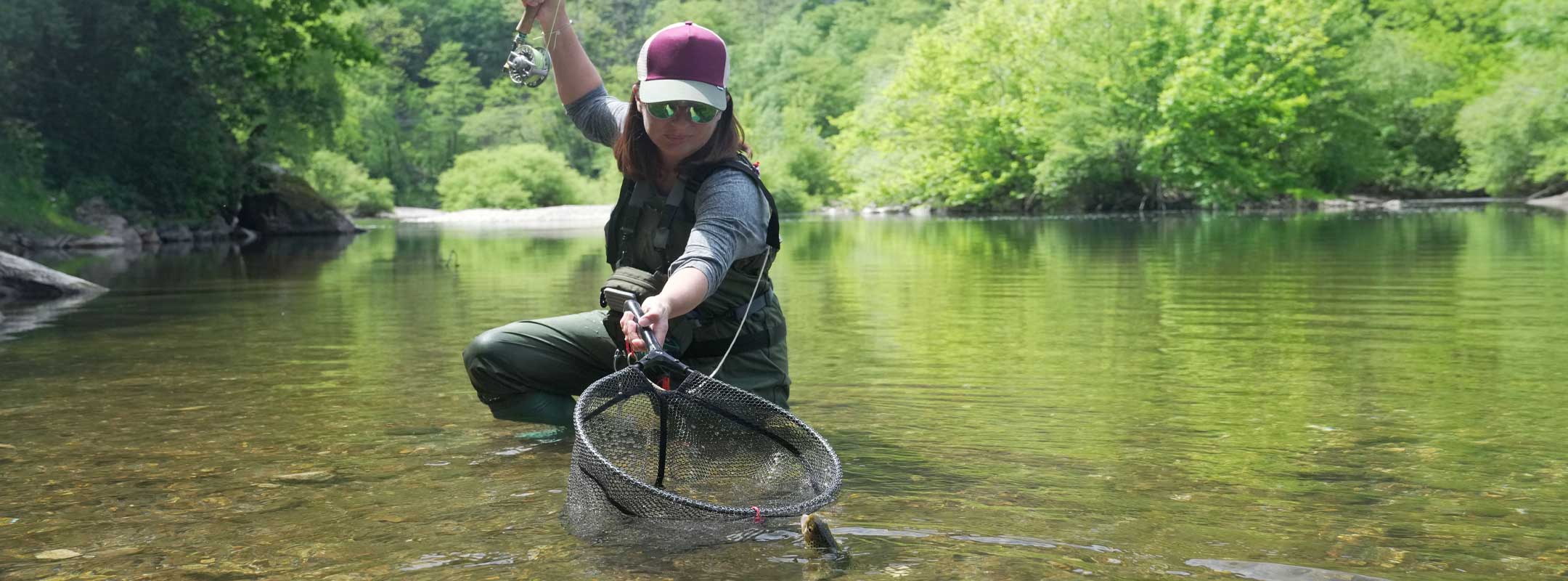 woman fly fishing with woolly bugger flies