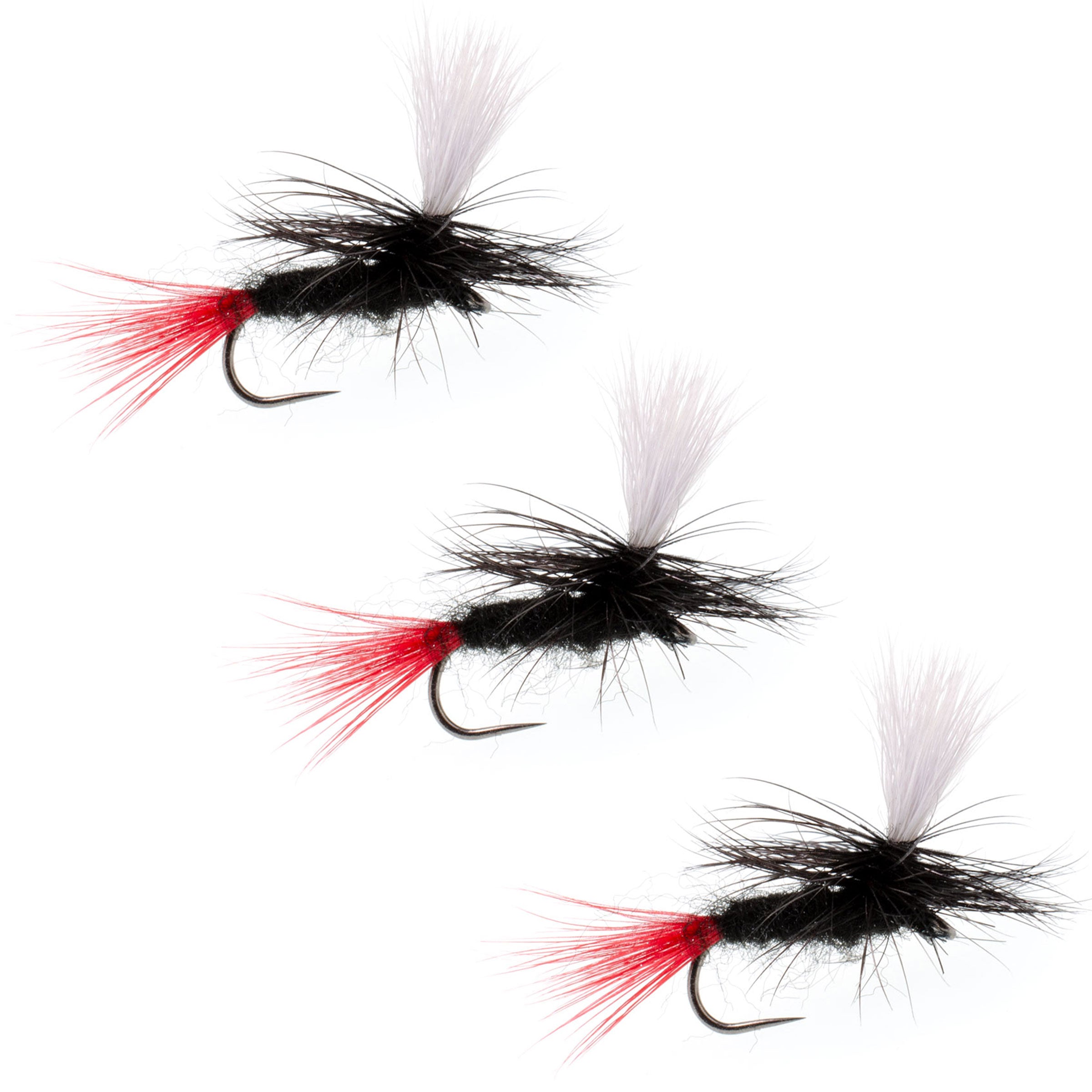 Three black and red fly fishing lures on a white background